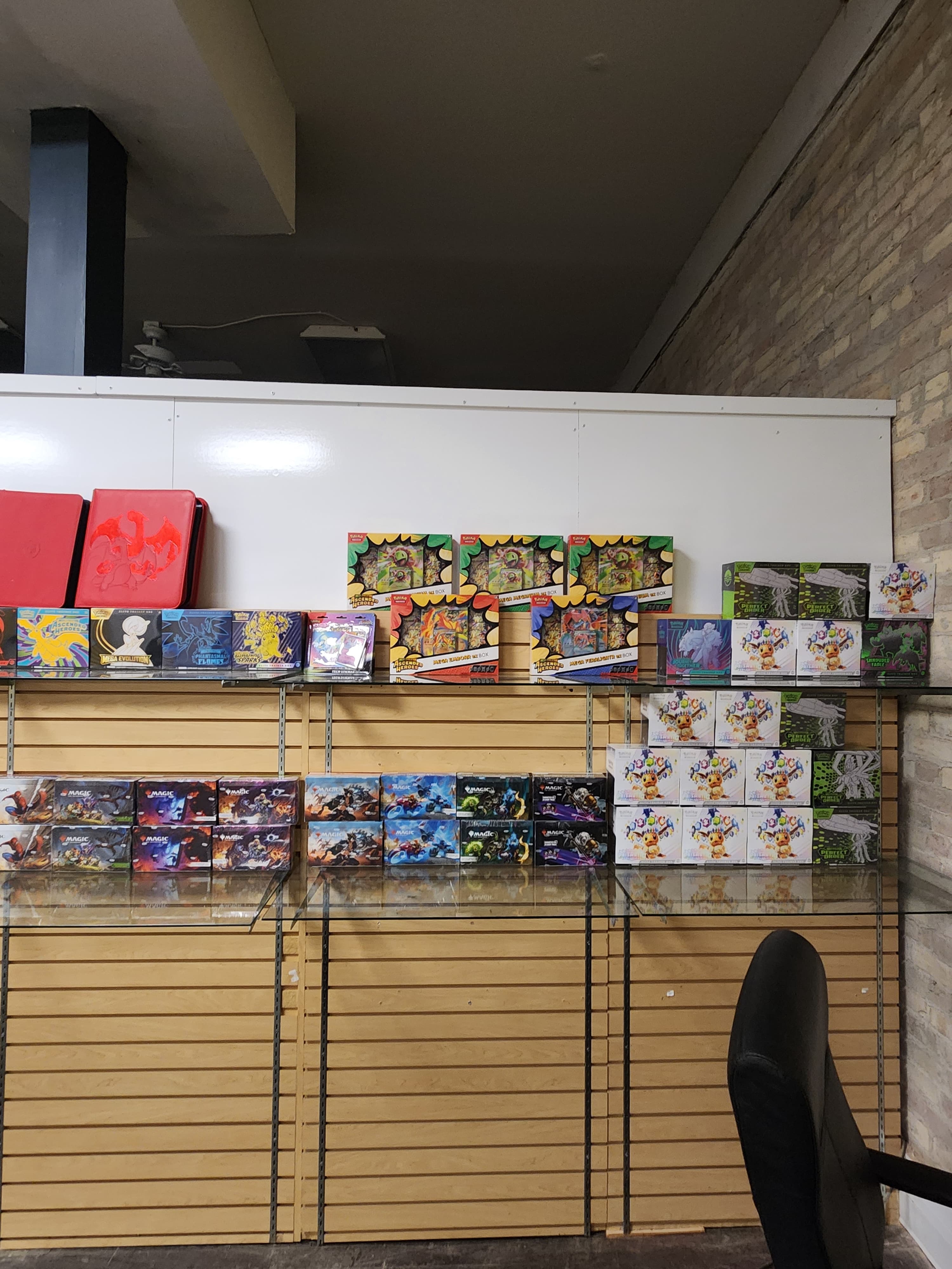 Pokemon singles display case inventory at The Wolf Den local game store in Montgomery, Minnesota