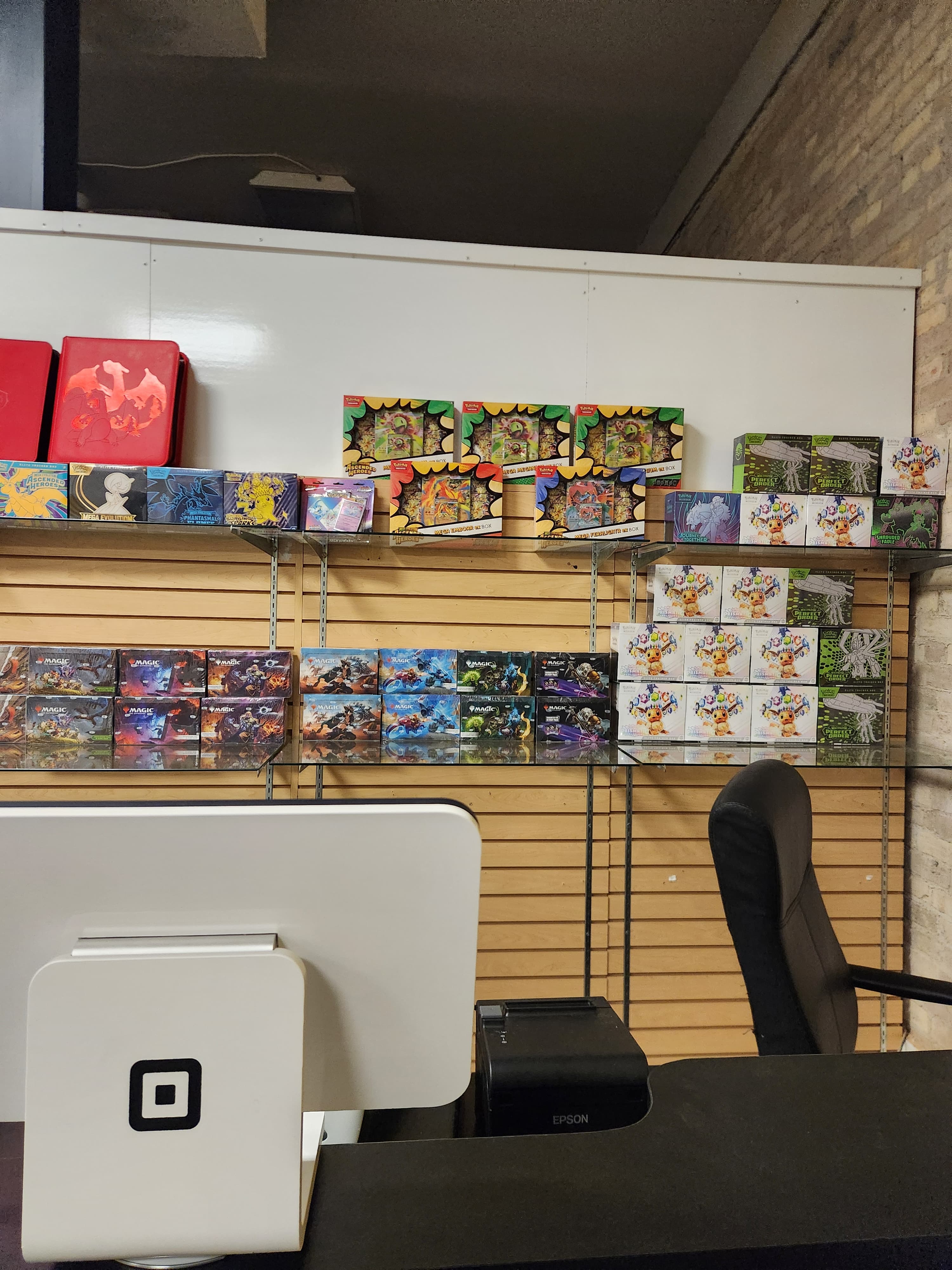 Wide interior shot of The Wolf Den storefront with product shelves and customer counter
