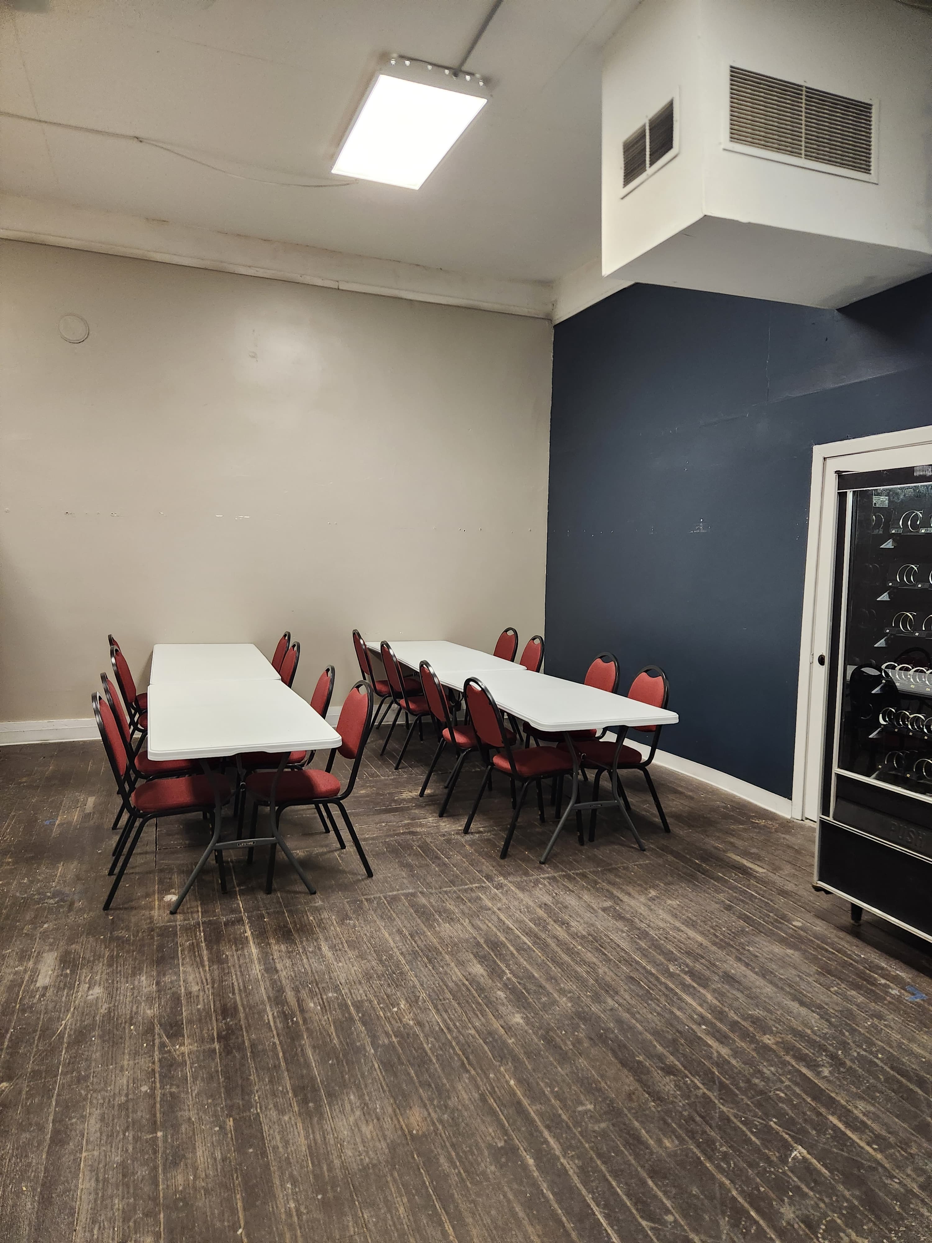 In-store card game tables set up for local events and casual play nights at The Wolf Den
